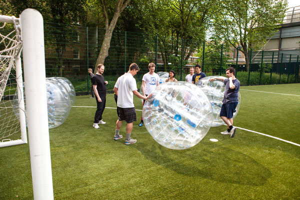 A Bubble instructor taking a group through the safety briefing and rules of the game in London