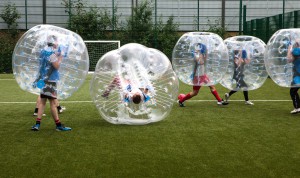 Group playing bubble football in London Waterloo